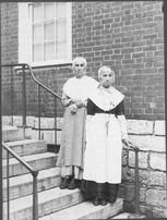SA0207 - Two older Shaker women from the West Family shown on steps.